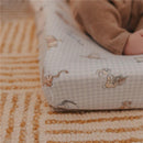 Premium diaper changing pad cover featuring Winnie the Pooh characters on a light checkered background.