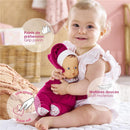 Infant in a ruffled white outfit hugging a Corolle Babipouce doll in pink with soft materials, highlighting grip points.