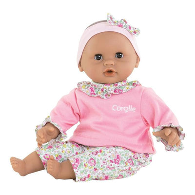 Bébé Calin Maria is a 12-inch Corolle baby doll wearing a pink top with a floral collar and matching floral pants, with a headband.