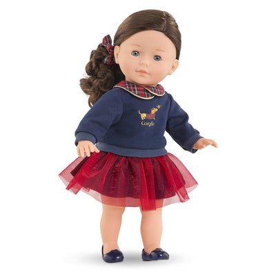 Corolle Ma Perle doll dressed in a navy sweater with a plaid collar and a red tulle skirt, standing upright.