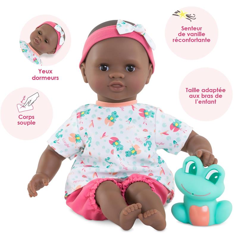 Corolle Mon Premier Poupon Bath Baby Alyzee doll with a pink headband, patterned shirt, and bath toy frog, featuring soft body and sleepy eyes.