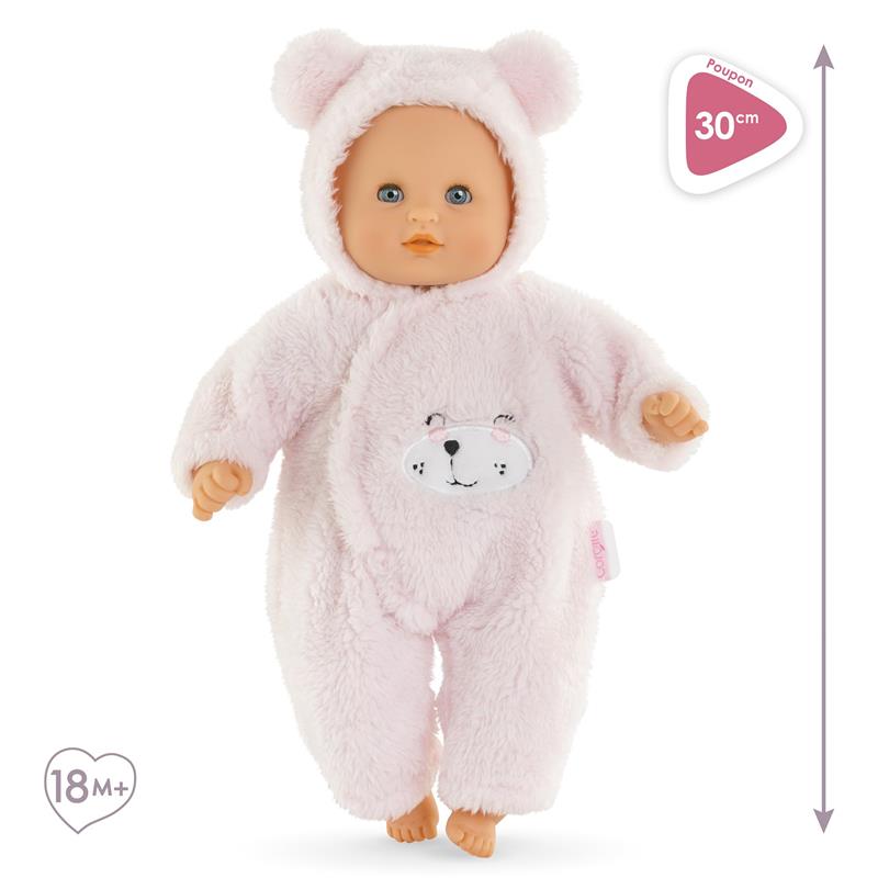 12-inch soft baby doll dressed in a pink teddy bear outfit with a bear face on the chest, suitable for ages 18 months and up.