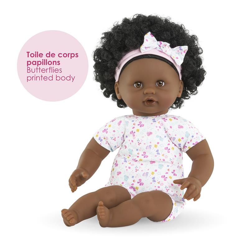 12-inch Corolle doll, Baby Calin Caroline, with curly black hair, wearing a butterfly-printed outfit and headband.