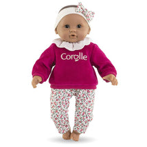 Corolle Dolls My First Pupon Baby Calin Maria Rose Grenadine wearing a pink sweater and floral pants, with a matching headband.