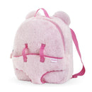 Plush pink backpack designed for carrying dolls, featuring bear ears and adjustable straps.