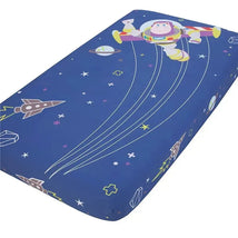 Crown Crafts Disney Buzz Lightyear crib fitted sheet featuring a blue space theme with Buzz Lightyear and rocket illustrations.