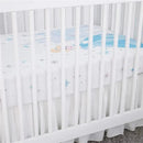 Crown Crafts Disney Cinderella crib fitted sheet featuring Cinderella and light blue star patterns, in a white crib.