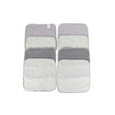 Eight rolled washcloths in various shades of gray and white, arranged neatly on a card for display.