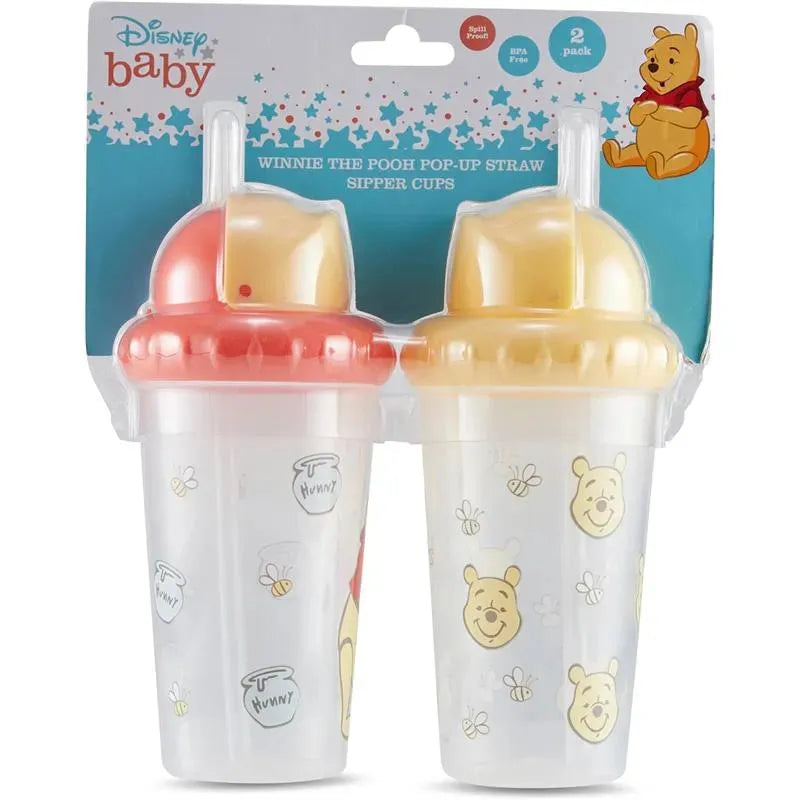 Two Winnie the Pooh sipper cups with pop-up straws, featuring designs of Pooh and honey pots, in a recyclable packaging.