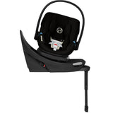 Cybex Aton G2 Swivel Infant Car Seat in Moon Black with a load leg base for secure installation.