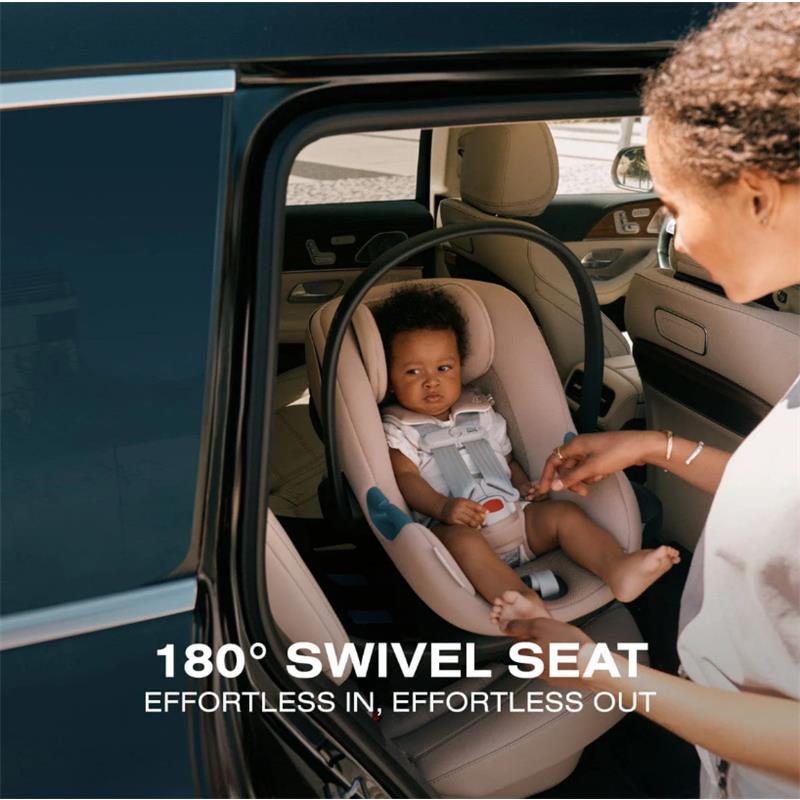 Cybex Aton G2 swivel infant car seat, stormy blue, featuring a 180° swivel seat, with a child securely strapped in.