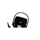Cybex Aton G2 baby car seat in moon black, featuring a soft padded interior and carrying handle.
