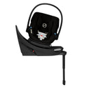 Cybex Balios S Lux Aton G2 swivel car seat in Moon Black, featuring a secure harness and adjustable support leg.