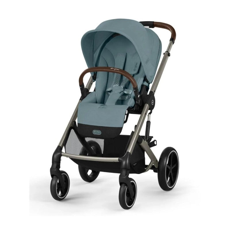 Cybex Balios S Lux stroller in Stormy Blue with a brown handle, featuring a car seat attachment and large rear wheels.