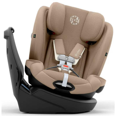 Cybex Callisto G 360° rotating all-in-one convertible car seat in almond beige, featuring a padded design and safety harness.