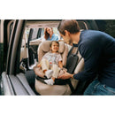 Cybex Callisto G 360° rotating all-in-one convertible car seat in ocean blue, with a happy child secured in the seat.