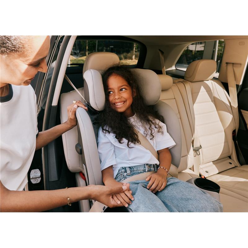 Cybex Callisto G 360 Select Rotating All-In-One Convertible Car Seat in black, with a smiling child secured in the seat.