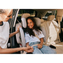 Cybex Callisto G 360 Select Rotating All-In-One Convertible Car Seat in black, with a smiling child secured in the seat.