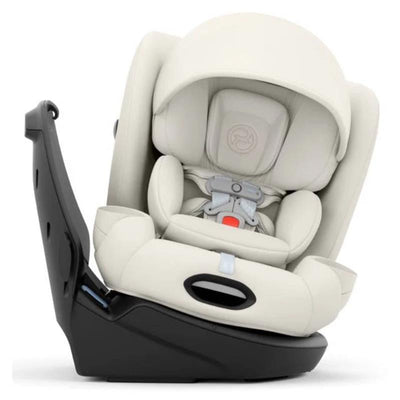 Cybex Callisto T 360 Rotating All-In-One Convertible Car Seat in off white, featuring a padded design and adjustable harness.