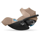 Cybex Cloud G Pro Comfort Extend Infant Car Seat in Almond Beige, featuring a sleek design and adjustable headrest.