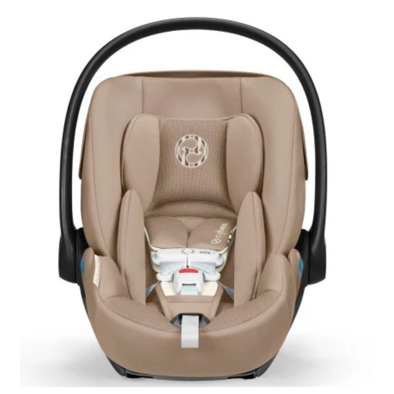 Cybex Cloud G Pro Comfort Extend Infant Car Seat in Almond Beige with a safety harness and a cushioned design.
