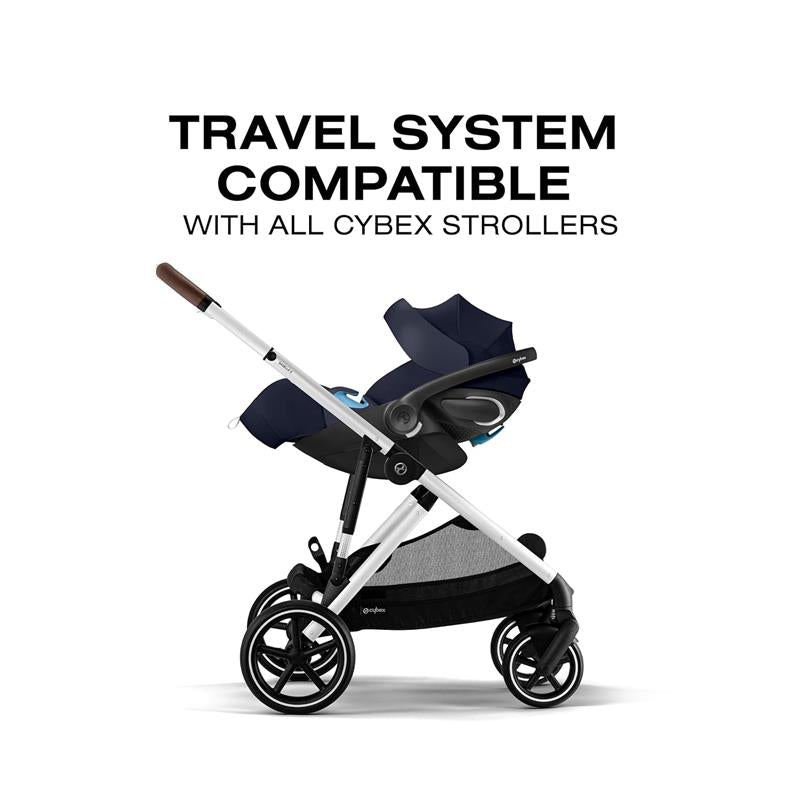 Cybex Cloud G Pro Comfort Extend Infant Car Seat in Ocean Blue, attached to a stroller with a travel system compatibility label.