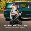 Cybex Cloud G Pro Comfort Extend Infant Car Seat in Stormy Blue, held by a woman near a vehicle, featuring ergonomic recline text.