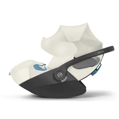 Cybex Cloud T Comfort Extend infant car seat in off-white with a dark base and adjustable sunshade.