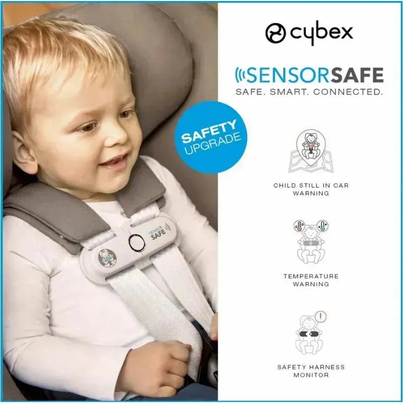 Infant in a Cybex Cloud T car seat with SensorSafe technology, showing features including safety warnings and a happy expression.