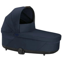 Cybex Cot S Lux 2 in Ocean Blue, featuring a sleek design with a hood and sturdy base, ideal for infants.