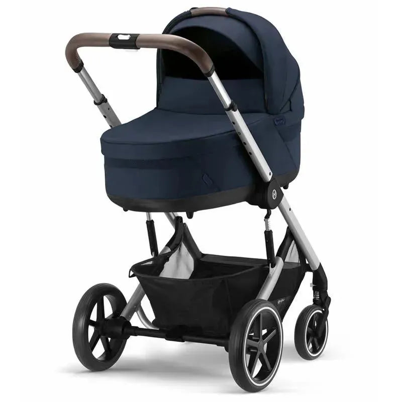 Cybex Cot S Lux 2 in Ocean Blue, featuring a sleek design with a padded bassinet and adjustable handlebar.