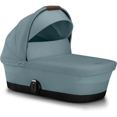 CYBEX eGazelle/Gazelle S cot bassinet in stormy blue, featuring a removable canopy and a sleek design for strollers.