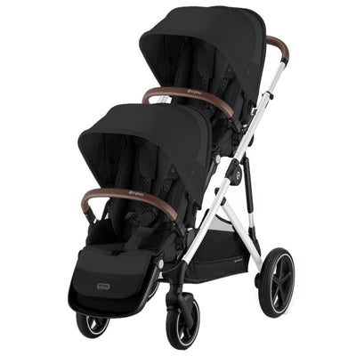 Cybex Gazelle S 2 Double Stroller in Moon Black with a silver frame, featuring two seats and brown accents.