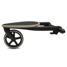 Cybex Gazelle S Kid board with a textured surface, black frame, and two wheels for easy mobility.