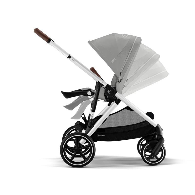Cybex Gazelle S stroller in silver frame with stone grey seat, featuring a folding canopy and sleek black wheels.