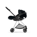 Cybex Mios 3 Stroller featuring a chrome and black frame with a sepia black seat pack, viewed from the side.