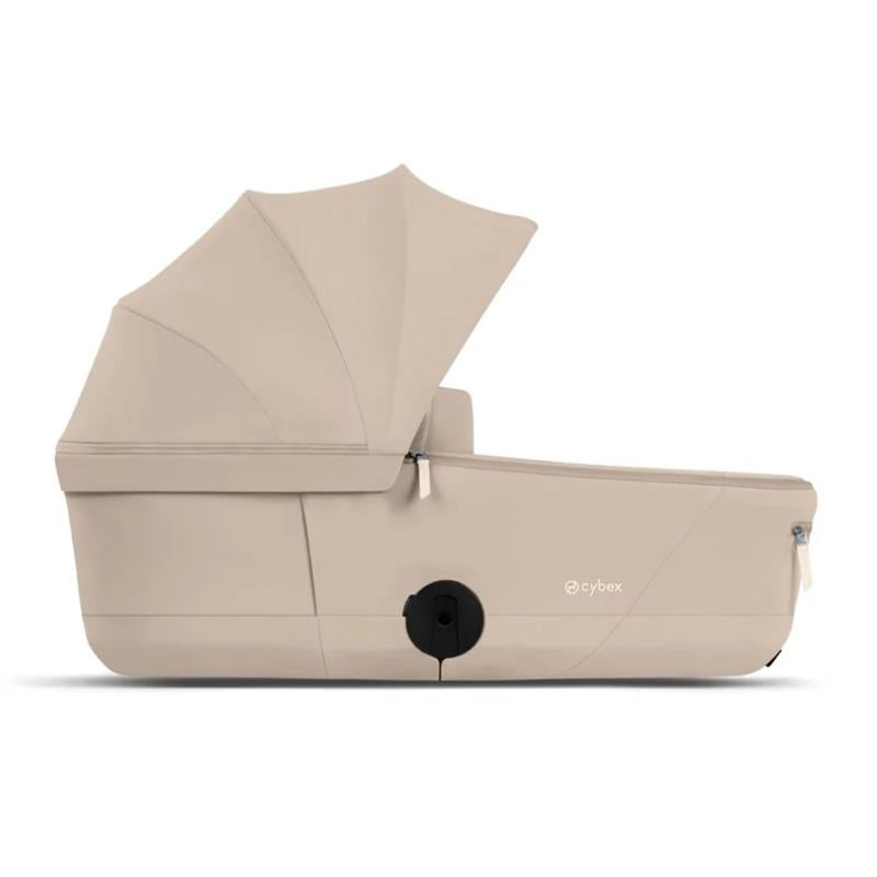 Cybex Mios/Coya Fold Lux Carry Cot in Cozy Beige, featuring a retractable canopy and a sleek design for infant transport.