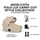Cybex Mios/Coya Fold Lux Carry Cot in Cozy Beige with sun sail, rain cover, and cot adapters included.