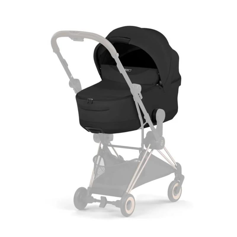 Cybex Mios/Coya Fold Lux carry cot in Sepia Black, designed for young infants, featuring a sleek, modern design and a zippered closure.
