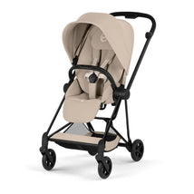 Cybex Mios stroller with a matte black frame and cozy beige lux seat, designed for comfort and mobility.