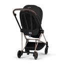 Cybex Mios stroller featuring a rose gold frame and sepia black lux seat, viewed from the back with a compact design.
