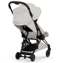 Cybex Platinum Coya Stroller in City Grey with a matte black frame, displayed from the rear.