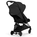 Cybex Platinum Coya Stroller in matte black frame with sepia black lux seat, displayed from the rear showing its sleek design and features.
