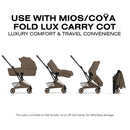 Cybex Platinum Coya stroller with a rose gold frame and coconut brown seat, demonstrating its folding features for convenient storage.