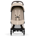 Cybex Platinum Coya stroller featuring a rose gold frame and a cozy beige luxe seat with harness system.