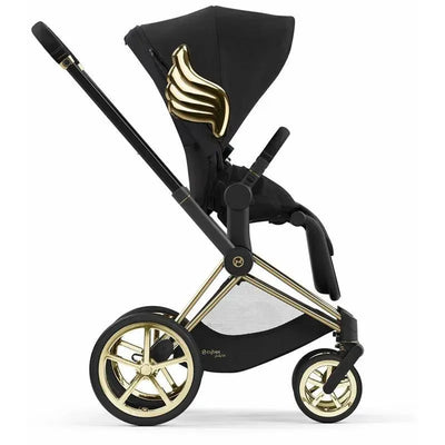 Cybex Priam 4 stroller with a black seat and gold wing-like design on the hood, featuring gold wheels and frame.