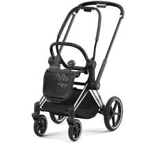 Cybex Priam 4 stroller frame in chrome and black, featuring a sleek design, ergonomic handles, and spacious storage.
