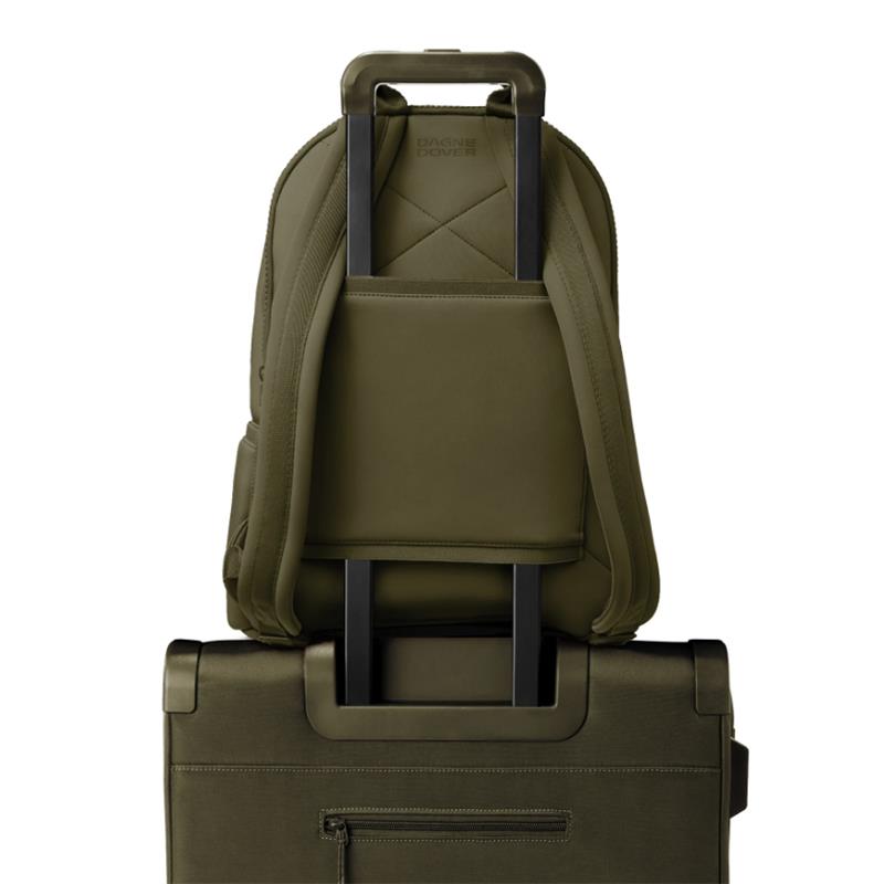 Large Dagne Dover Dakota Backpack in dark moss, featuring a sleek design and straps, positioned above a rolling luggage handle.