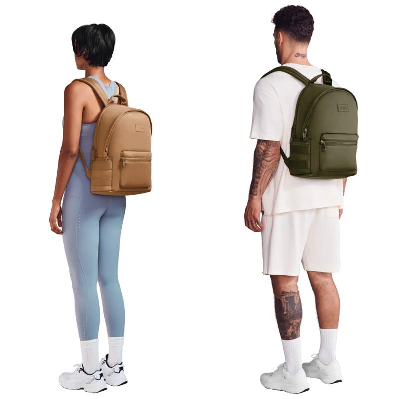 Dagne Dover Dakota Backpack in Dune, shown on a woman in blue workout attire and a man in casual white clothing.