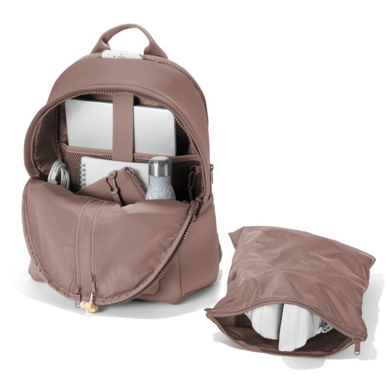Large Dagne Dover Dakota backpack in Dune, featuring an open compartment with a laptop, water bottle, and accessories alongside a matching pouch.
